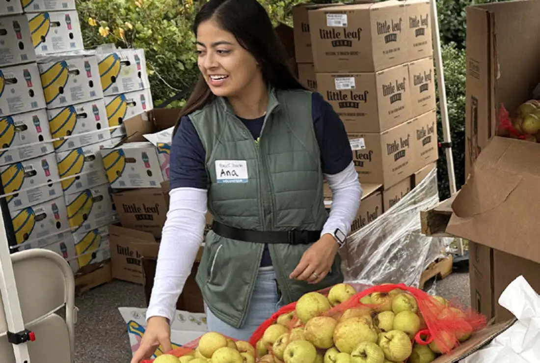 Volunteers sorting fresh produce at food bank
